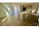 Open concept kitchen with island and laminate flooring at 46 Kidd And Brown Rd, Hiddenite, NC 28636