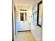 Clean bathroom with white vanity and tiled floor at 6130 Heathstone Ln, Charlotte, NC 28210