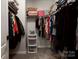 Well-organized walk-in closet with ample shelving and hanging space at 6725 Dusty Saddle Rd, Charlotte, NC 28277