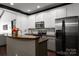 Modern kitchen with stainless steel appliances and granite countertops at 6725 Dusty Saddle Rd, Charlotte, NC 28277