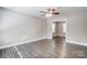 Light-filled living room with hardwood floors and access to another room at 921 Pineridge Se St, Concord, NC 28025