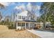 Two-story house with gray siding, a driveway, and landscaping at 925 Pineridge Se St, Concord, NC 28025