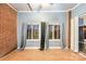 Sunroom with windows and brick wall at 9267 Meadow Vista Rd, Charlotte, NC 28213