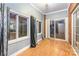 Bright sunroom with wood floors and brick wall at 9267 Meadow Vista Rd, Charlotte, NC 28213