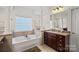 Elegant bathroom featuring a soaking tub and separate shower at 10113 Allison Taylor Ct, Cornelius, NC 28031