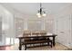 Charming breakfast nook with a rustic wooden table and bench at 10113 Allison Taylor Ct, Cornelius, NC 28031