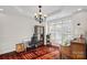 Elegant dining room with hardwood floors and large windows at 10113 Allison Taylor Ct, Cornelius, NC 28031