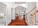 Bright and spacious entryway with hardwood floors and staircase at 10113 Allison Taylor Ct, Cornelius, NC 28031