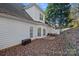 Home's exterior with patio and surrounding landscape at 10113 Allison Taylor Ct, Cornelius, NC 28031