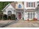 Two-story home with a charming front entrance and landscaping at 10113 Allison Taylor Ct, Cornelius, NC 28031