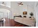 Spacious living room featuring hardwood floors, a fireplace, and high ceilings at 10113 Allison Taylor Ct, Cornelius, NC 28031