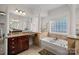 Large main bathroom with double vanity and a soaking tub at 10113 Allison Taylor Ct, Cornelius, NC 28031