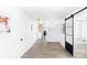 Long hallway with modern barn door and hardwood floors at 1100 Rainier Ln, Gastonia, NC 28052