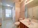 Clean bathroom with tile floor, toilet, vanity, and linen closet at 11116 Northwoods Forest Dr, Charlotte, NC 28214