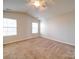 Spacious bedroom with carpet and ceiling fan at 11116 Northwoods Forest Dr, Charlotte, NC 28214