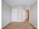 Bright bedroom with carpet, double closets, and access to hallway at 11116 Northwoods Forest Dr, Charlotte, NC 28214