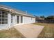 Back exterior with sliding glass doors leading to a patio area at 12610 Cumberland Crest Dr, Huntersville, NC 28078