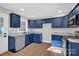 Newly remodeled kitchen with blue cabinets and granite countertops at 187 Shumaker Dr, Statesville, NC 28625