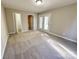 Bright bedroom with carpet flooring, double doors, and access to a bathroom at 2117 Arden Dr, Monroe, NC 28112