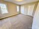 Well-lit bedroom with neutral walls and carpet flooring at 2117 Arden Dr, Monroe, NC 28112