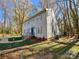 Two-story house with gray siding, showcasing its side profile and landscaping at 2117 Arden Dr, Monroe, NC 28112