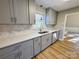 Modern kitchen with gray cabinets, quartz countertops, and stainless steel appliances at 2117 Arden Dr, Monroe, NC 28112