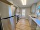 Updated kitchen with stainless steel appliances and light wood flooring at 2117 Arden Dr, Monroe, NC 28112