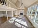 Spacious living room with vaulted ceiling, fireplace, and wall of windows at 2117 Arden Dr, Monroe, NC 28112