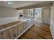 Open living room with hardwood floors and a view into the Gathering room at 2117 Arden Dr, Monroe, NC 28112