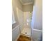 Simple shower stall with white walls and flooring at 2117 Arden Dr, Monroe, NC 28112