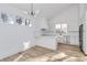 Modern white kitchen with stainless steel appliances and light wood flooring at 2601 Mcgill St, Kannapolis, NC 28081