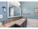 Bathroom vanity with a large mirror and tile countertop at 318 N Elm St, Marshville, NC 28103