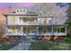 Charming two-story home with a welcoming front porch and landscaped yard at 318 N Elm St, Marshville, NC 28103