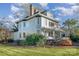 Side view of the home highlighting its architecture and landscaping at 318 N Elm St, Marshville, NC 28103