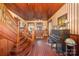 Grand foyer with hardwood floors, staircase, and a piano at 318 N Elm St, Marshville, NC 28103