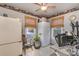 Compact kitchen area with white appliances, workspace, and a window view at 318 N Elm St, Marshville, NC 28103