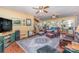 Living room with large windows, wood floors, and comfortable seating at 318 N Elm St, Marshville, NC 28103