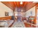 Second floor landing with wood floors and paneling at 318 N Elm St, Marshville, NC 28103