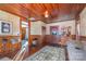 Charming sitting room with wooden paneling and vintage furniture at 318 N Elm St, Marshville, NC 28103