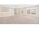 Large bedroom with neutral carpet and multiple windows at 3449 Pikes Peak Dr, Gastonia, NC 28052