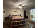 Spacious bedroom with wood framed bed and ceiling fan at 369 Pinecrest Cir, Troy, NC 27371