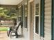 Relaxing front porch with seating and a swing at 369 Pinecrest Cir, Troy, NC 27371