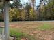 Front yard with partial view of wooded area at 369 Pinecrest Cir, Troy, NC 27371