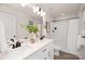 Double vanity bathroom with shower/tub combo and white cabinets at 405 Durham Ave, Statesville, NC 28677