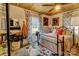 Charming bedroom with a metal bed frame and floral curtains at 405 W Carroll St, Cherryville, NC 28021