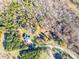 House nestled in wooded area, with a long driveway and shed at 5164 Green Rd, Stanley, NC 28164