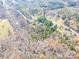 Property overview showing house, road, and surrounding landscape at 5164 Green Rd, Stanley, NC 28164