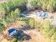 House and shed surrounded by trees and a long driveway at 5164 Green Rd, Stanley, NC 28164