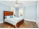 Bright bedroom featuring a comfortable bed and hardwood floors at 5164 Green Rd, Stanley, NC 28164