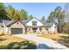 Stunning two-story home with stone accents and a large driveway at 5164 Green Rd, Stanley, NC 28164